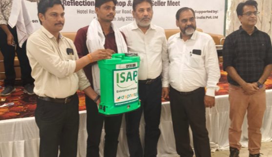 Cropnosys and ISAP representatives handing over a sprayer to a farmer at a reflection workshop and buyer–seller meet
